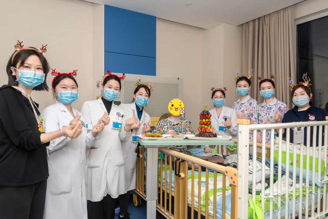 Jingdu medical staff surrounding Abu with blessings during Christmas